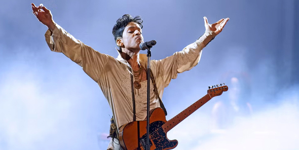 Prince on stage at the Hop Farm Festival 2011.